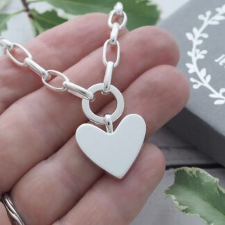 2cm wide, 3mm thick solid silver heart suspended from a elongated belcher chain