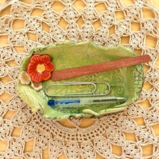"green-dish-with-red-flower"