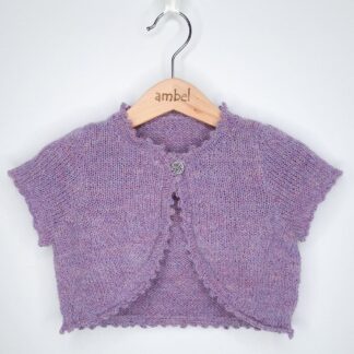 Stunning handknitted girls bolero cardigan in luxurious Peruvian wool combining merino, alpaca and silk fibres.