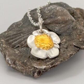 Handcrafted recycled silver buttercup pendant with 24k gold highlights