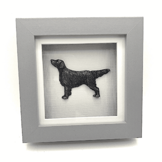Flat coated retriever Relief sculpture in cold cast metal mounted in a small box frame by sculptor Kirsty Armstrong