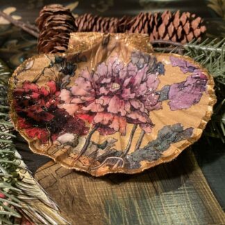 A pretty decoupaged handmade scallop shell