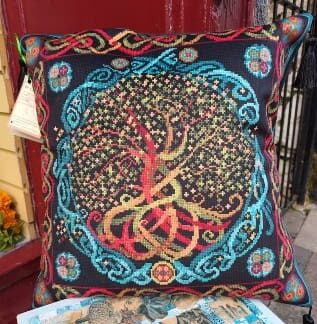 A luxury velvet cushion featuring a Celtic Tree of Life design.