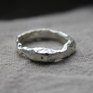 organic textured sand cast ring with flush set tiny cz