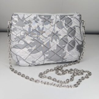 Chic silver handbag with a quilted texture and versatile chain strap
