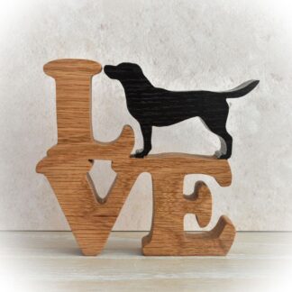 Handcrafted oak LOVE sign with a standing Black Labrador replacing the letter O