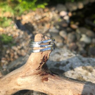 Three hammered silver rings soldered into a single wave ring.