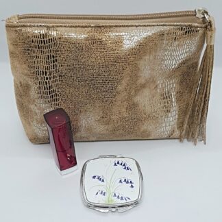Bluebell art mirror compact shown with make-up bag