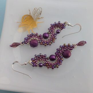 Handmade purple beaded wave dangle earrings