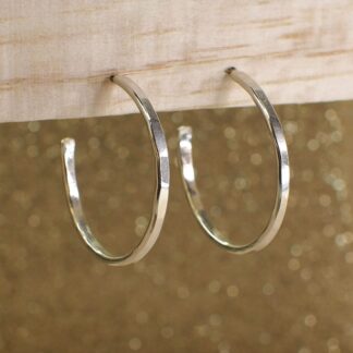 classic sterling silver hammered hoops on stand