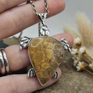 turtle pendant handmade in recycled sterling silver with a coral fossil stone as a shell