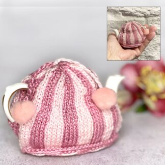 Collectible miniature pink striped tea cosy hand knitted in traditional style on miniature teapot