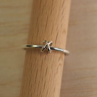 single knot bead fidget ring on stand