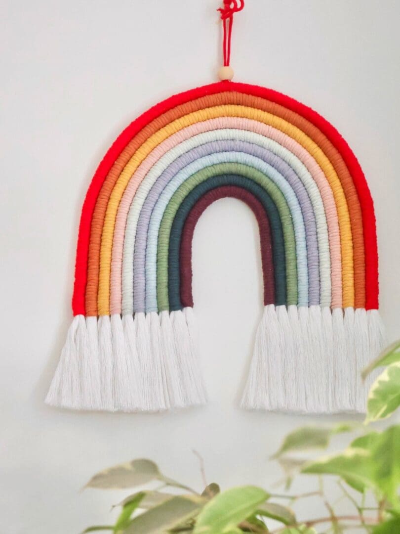 Close-up of XXL Macramé Rainbow showing intricate handwoven details and soft, eco-friendly cotton fibres
