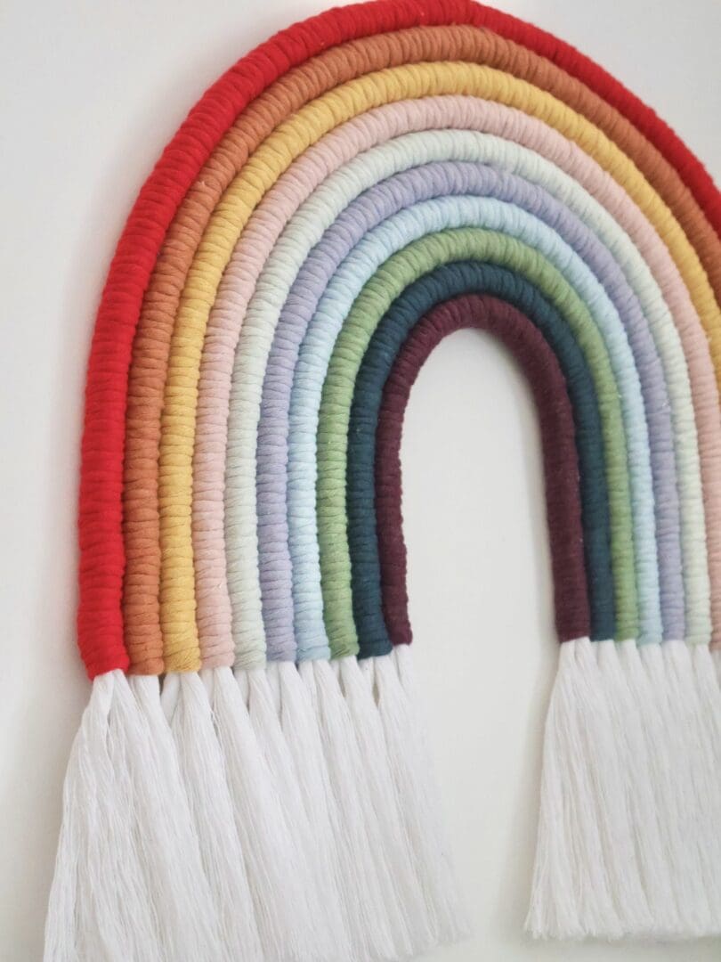 Close-up of XXL Macramé Rainbow showing intricate handwoven details and soft, eco-friendly cotton fibres