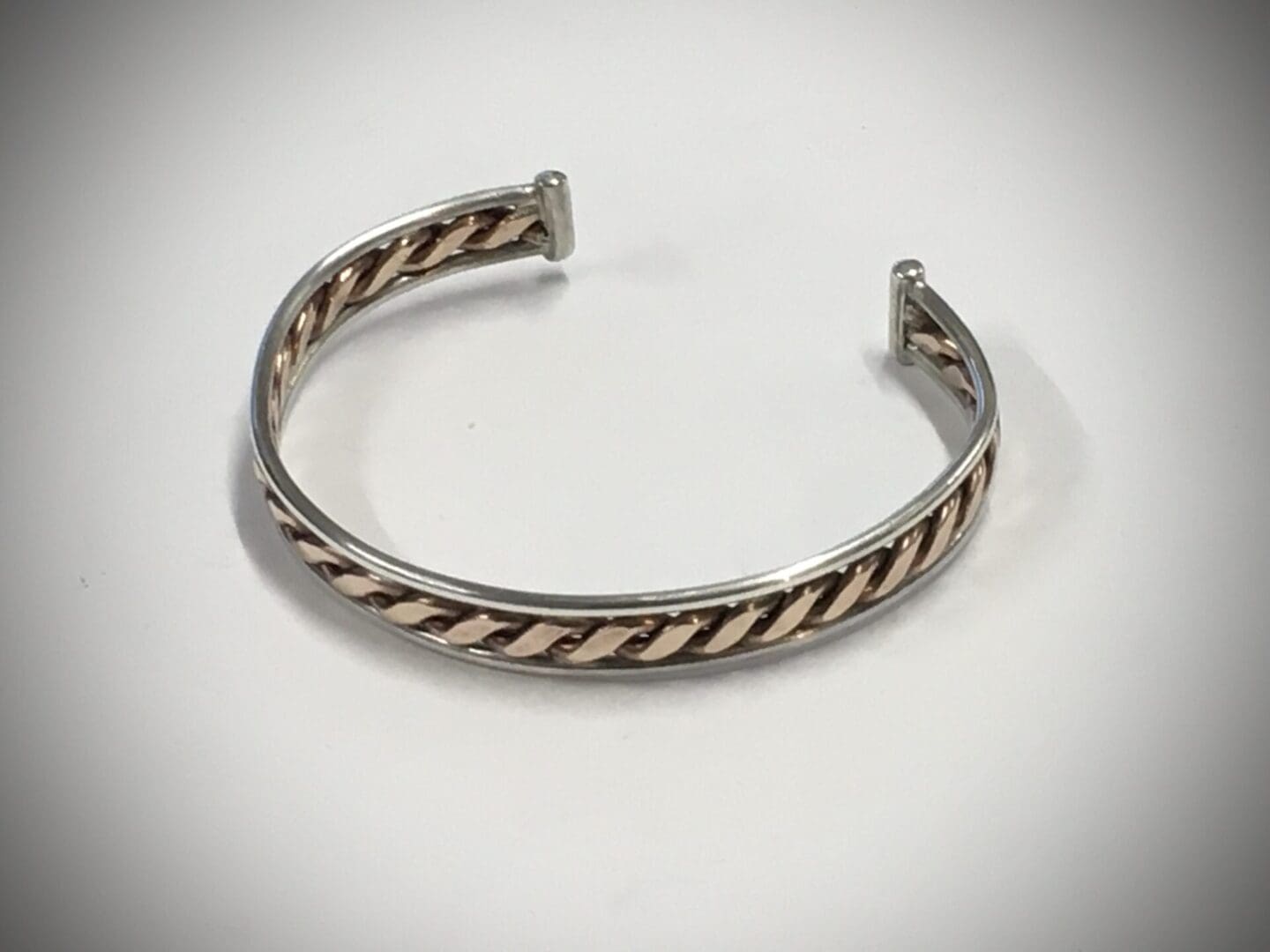 Bronze twist bangle edged with silver