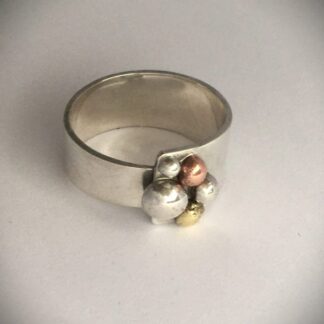 Silver copper and brass pebble ring