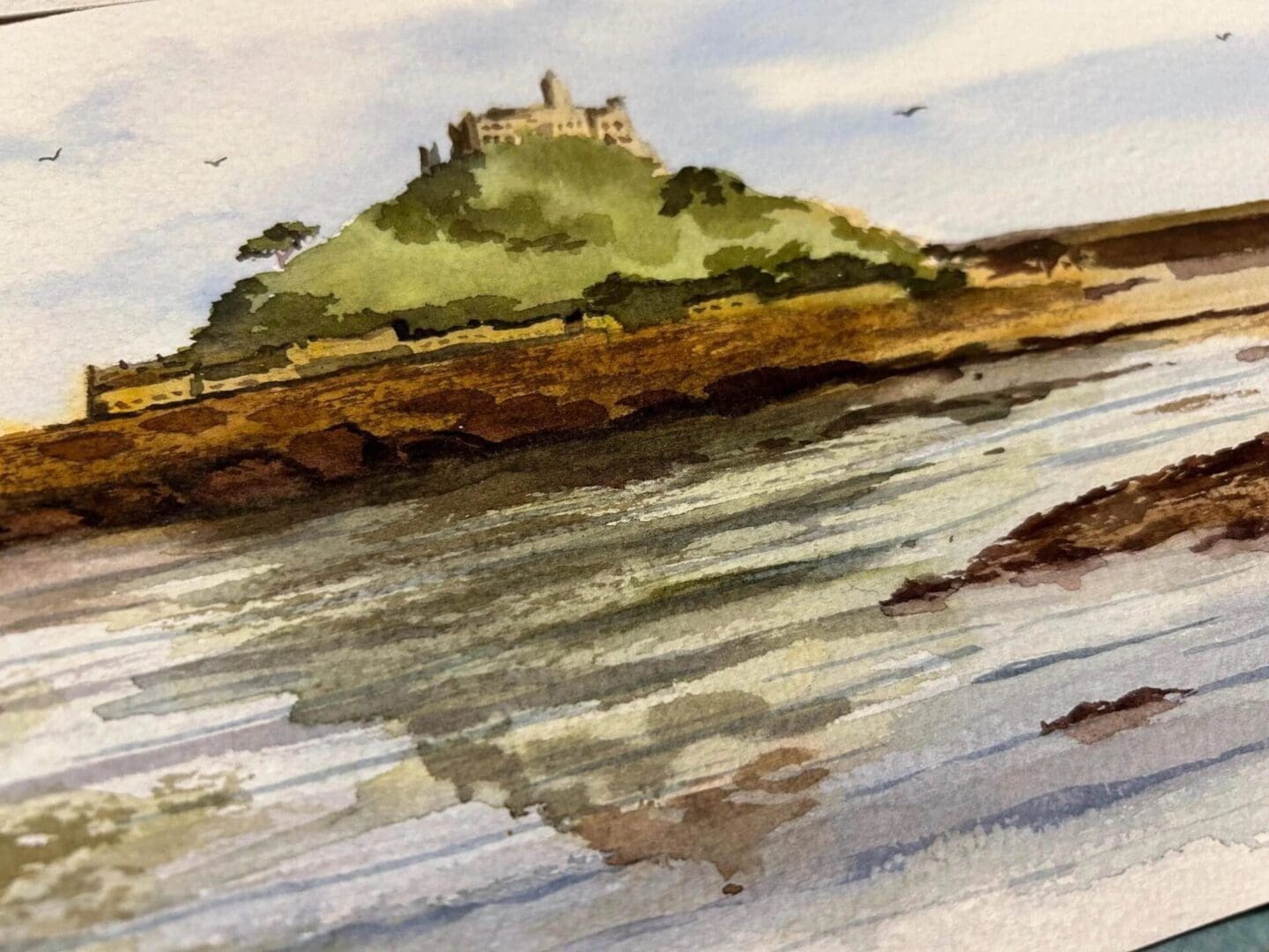 close up a loose watercolour painting of St Michaels Mount, near Penzance, Cornwall