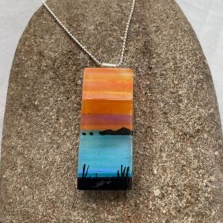 sunset glass pendant on silver chain