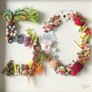 50th wedding anniversary celebration made up of 3D items hand stitched into a 50 shape
