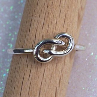 Sterling silver Celtic knot ring on mandrel