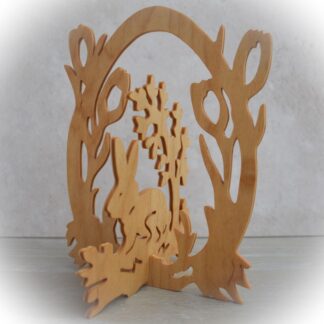 Handcrafted wooden Easter bunny decoration with floral egg fretwork design
