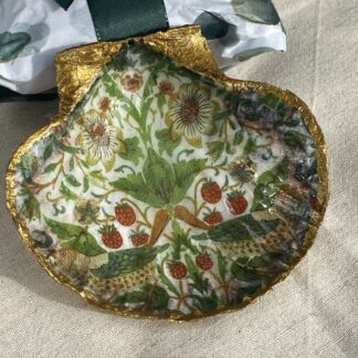 A handmade decoupaged scallop shell featuring a William Morris Design