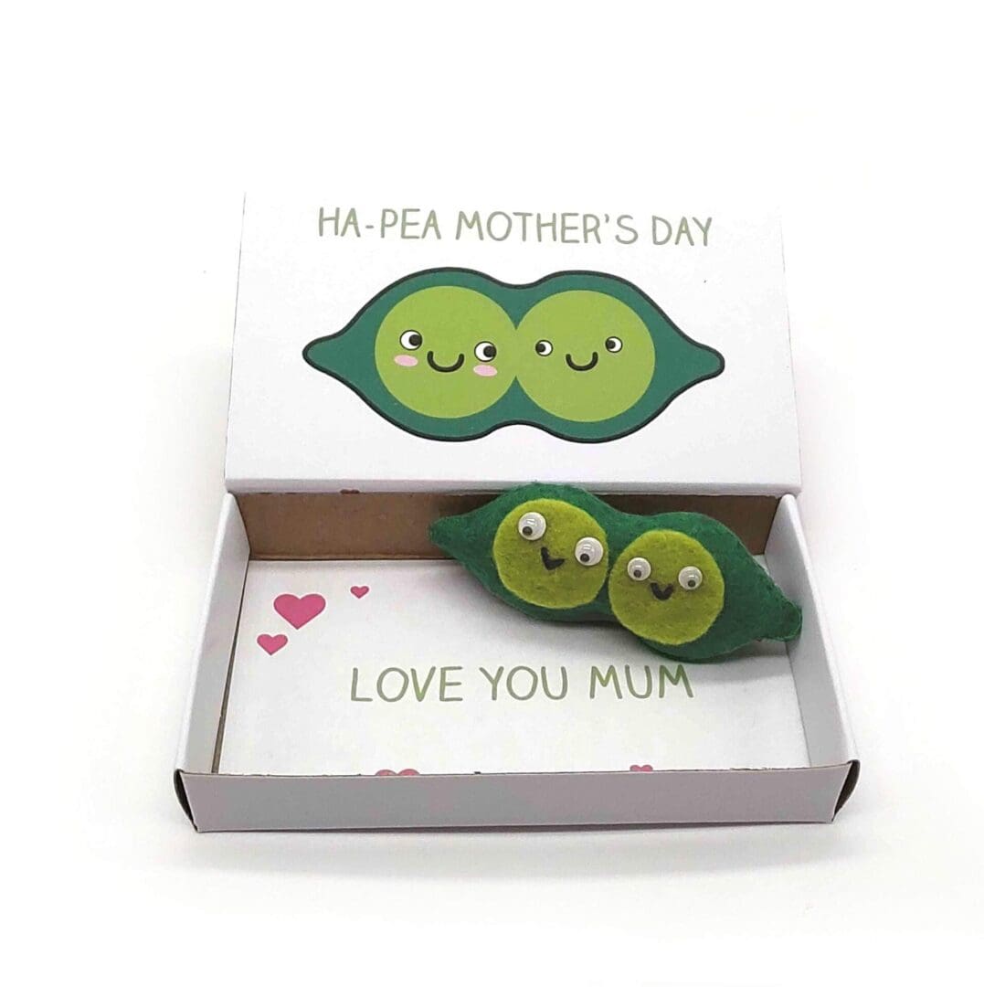 Cute Mother's Day gift. Two happy peas in a pob magnet in an illustrated matchbox which reads Ha Pea Mother's Day on the outside and Love you MuM on the inside