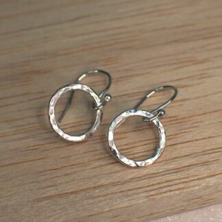 open circle drop earrings on table