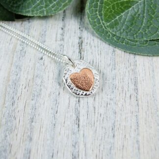 silver pebble and copper heart necklace