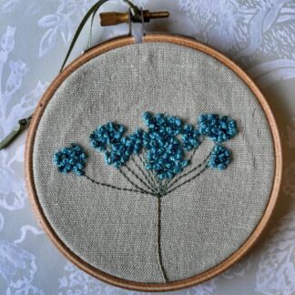 Blue beaded Cow parsley on a 4" embroidery hoop.