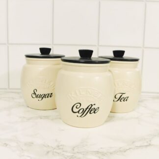 cream and black kitchen canisters