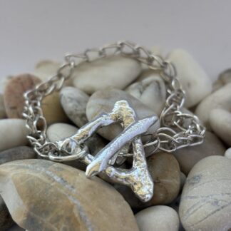 Sterling silver handmade bracelet with foxtail chain and molten triangular toggle clasp