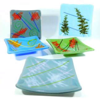selection of abstract patterned fused glass trinket dishes