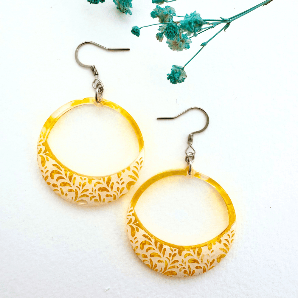Sunshine yellow hoop earrings with floral lace detailing on hypoallergenic surgical steel earring hooks