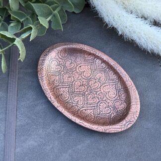 Copper trinket dish with a lace heart texture pattern