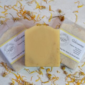 Yellow soap bars sitting on a bed of yellow calendula flower petals