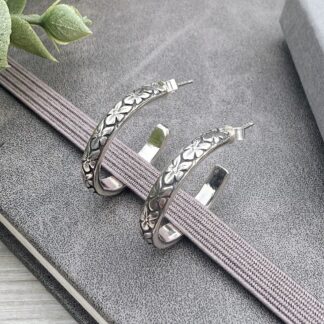 Sterling silver flower half hoop earrings