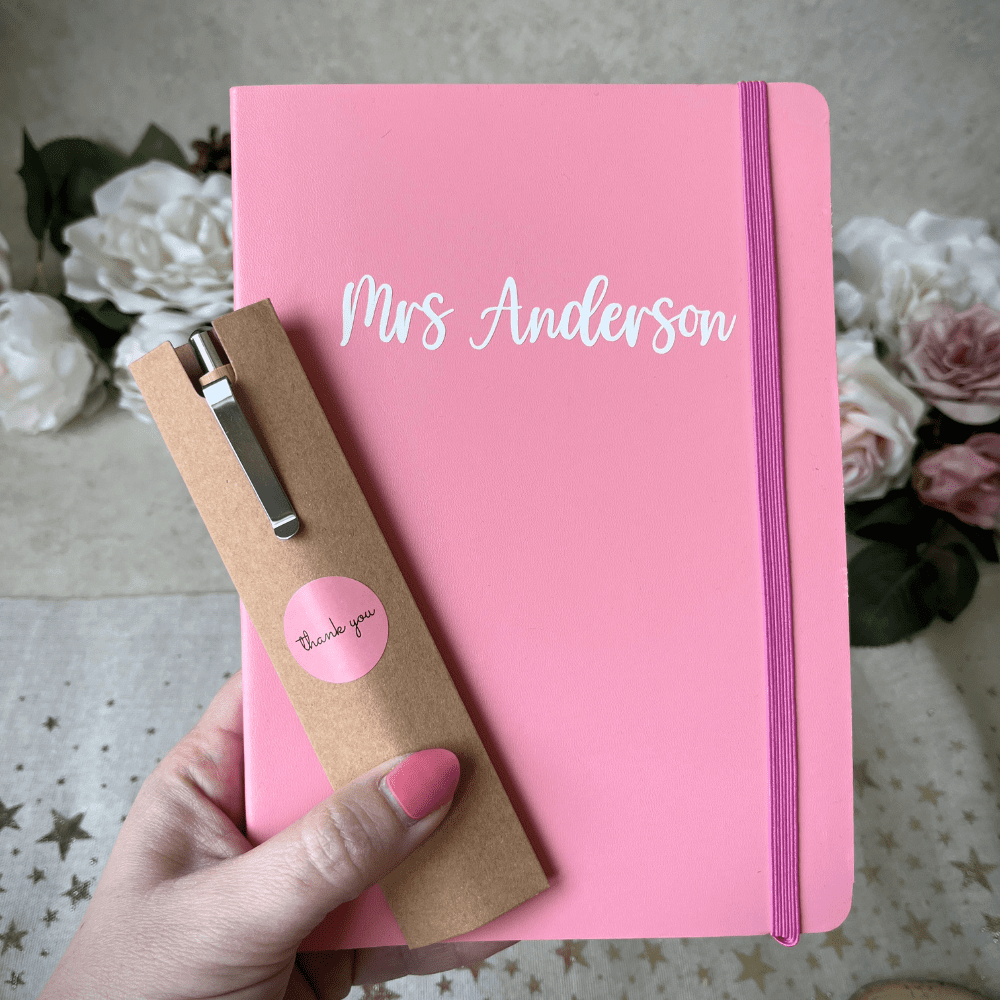 Pink A5 notebook with white name personalisation and elastic strap