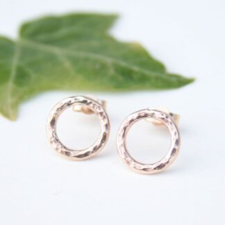 Solid gold circle stud earrings with a hammered finish