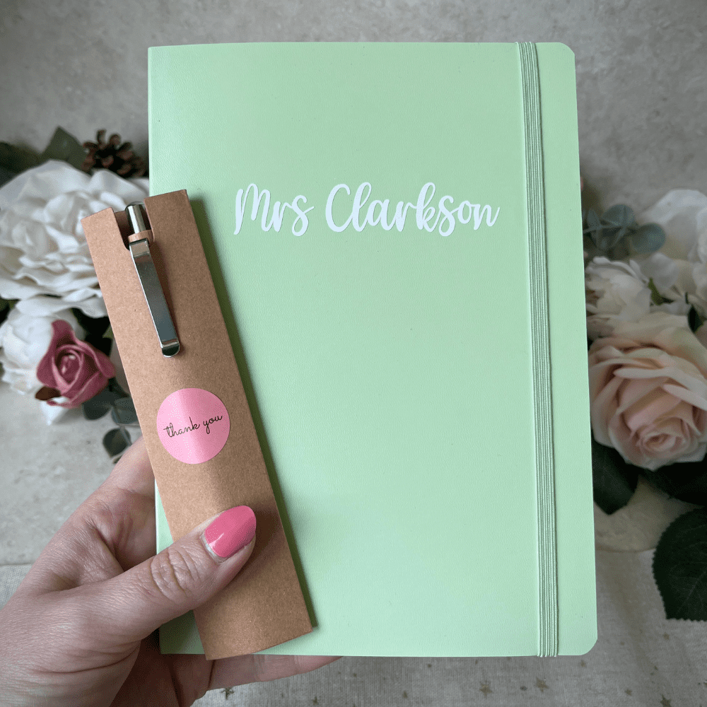 Green soft-touch notebook personalised with teacher’s name