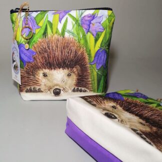 Hedgehog and harebells print make up bag with a gusset base. Pale purple reverse.