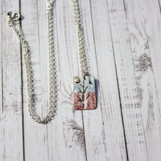 Silver and copper silhouette tree pendant necklace
