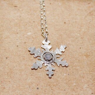 Sterling silver snowflake pendant with moonstone gem