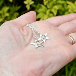 Silver star pendants with Topaz