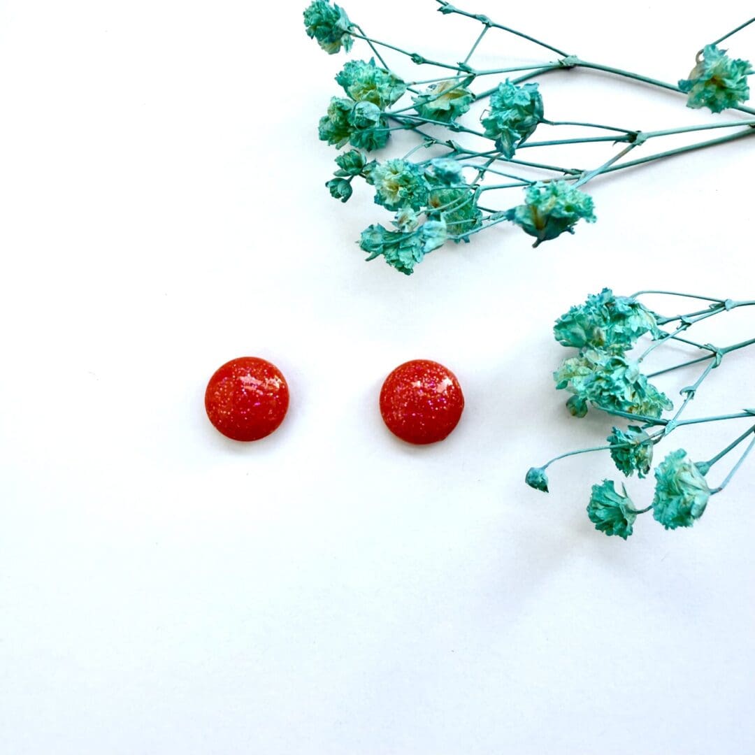 10 mm semi domed sparkly orange stud earrings