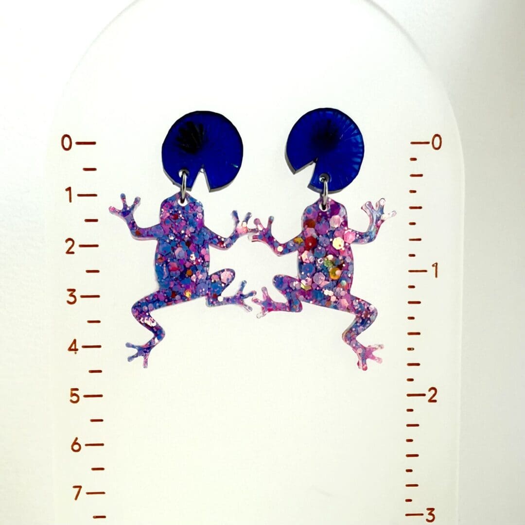 Handmade pink glitter frog earrings with blue lily pad tops. - Image 3