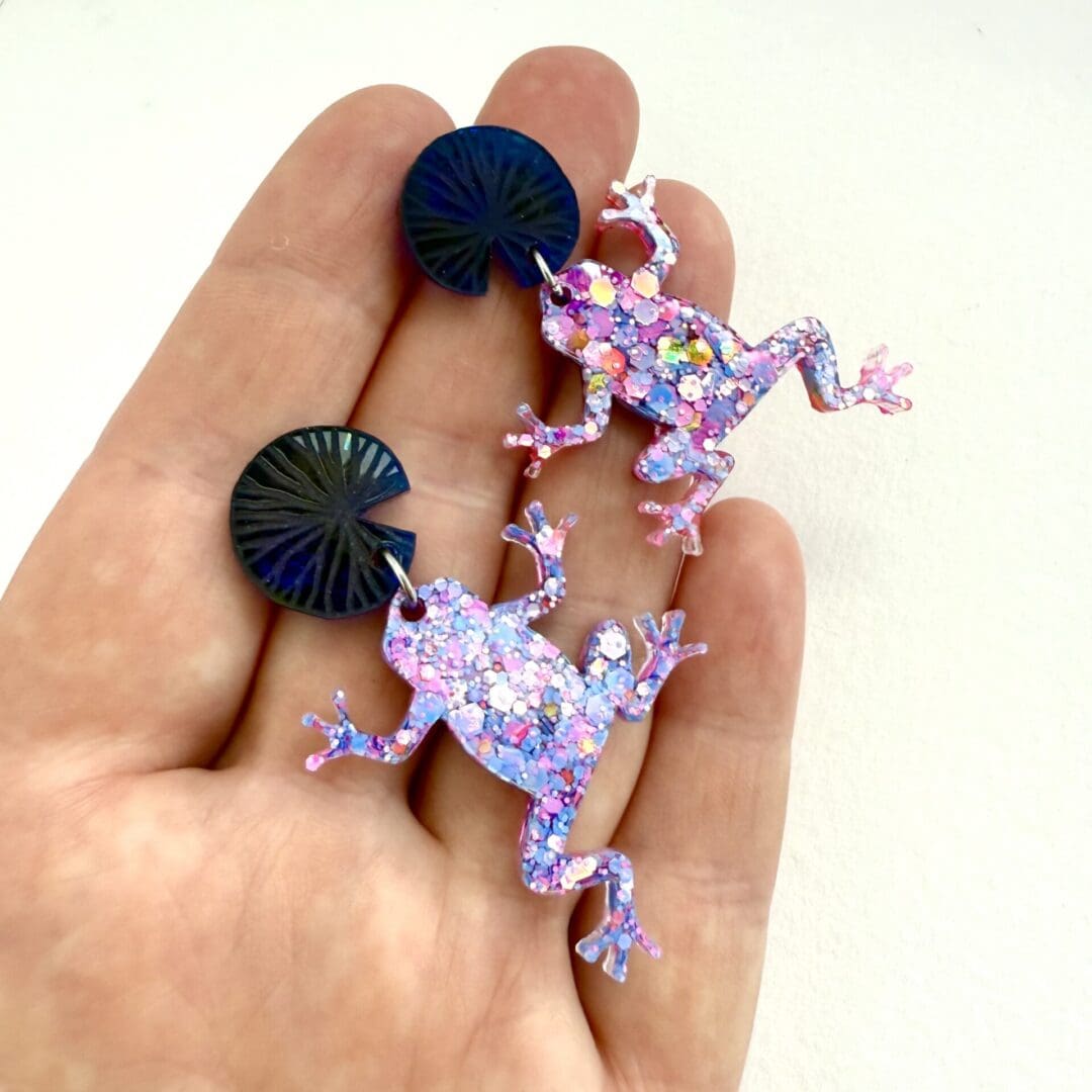Handmade pink glitter frog earrings with blue lily pad tops. - Image 2