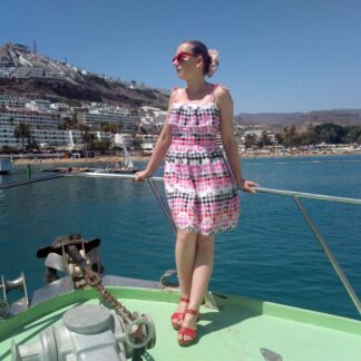 Retro style summer dress inspired by vintage 1950s fashion, in pink black cream gingham fabric.