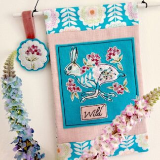 Pink and blue floral running hare fabric art wall hanging - handmade textile animal decoration for home decor